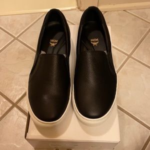 MCM black slip ons
